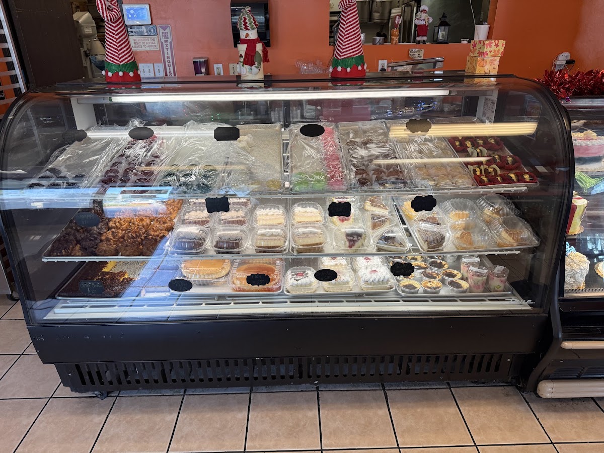 The refrigerated case with cheesecakes, fruit tarts and individual desserts
